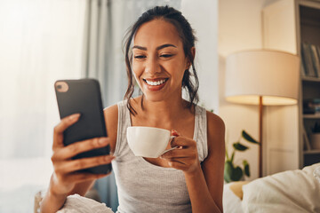 Morning coffee, phone and happy woman in bedroom for social media, scroll and text message in home....