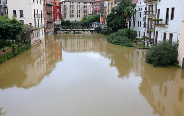 Retrone river in the city of Vicenza in Northern Italy during the flood and old bridge called Ponte...