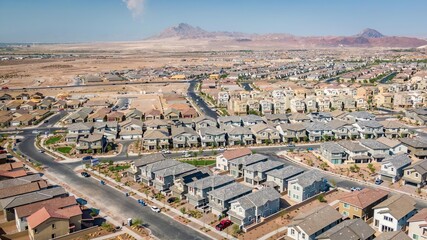 Residential development in Henderson, Las Vegas, Nevada showcasing new homes and dry mountainous landscape under clear skies