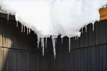 Icicles on a roof.