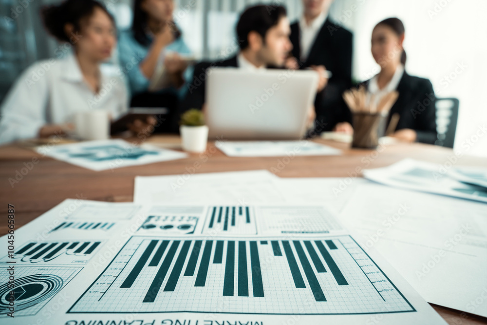 Aufkleber piles of analyzed financial data dashboard on meeting table with background of business people analy