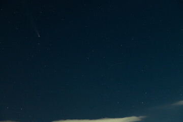 Comet C/2023 /A3 Tsuchinshan-Atlas at the starry sky.