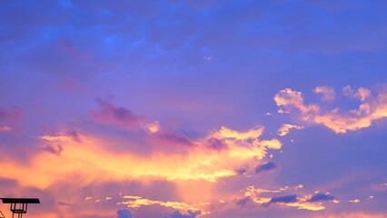 The sun sets in the evening and the sky is purple-orange with beautiful clouds.