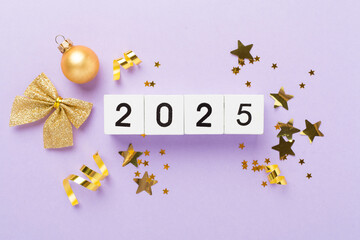 2025 with confetti and decor on color background, top view