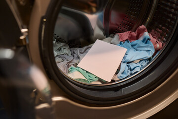 Laundry Process Illustrated with a Hand Gripping a Blank Sheet in the Background