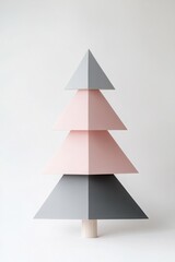 Fototapeta premium Geometric pastel christmas tree design with triangular layers on white background