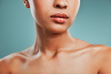 Beauty, collarbone and wellness with woman in studio isolated on blue background for hygiene...