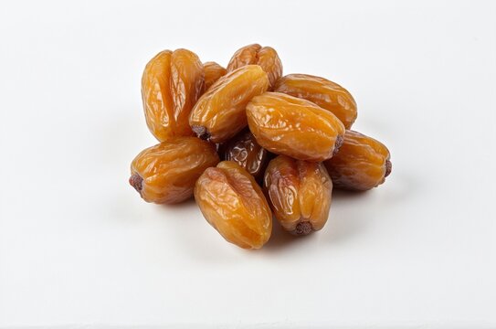Heap of Big Zahidi Dates with Leaves Levitating on White Background