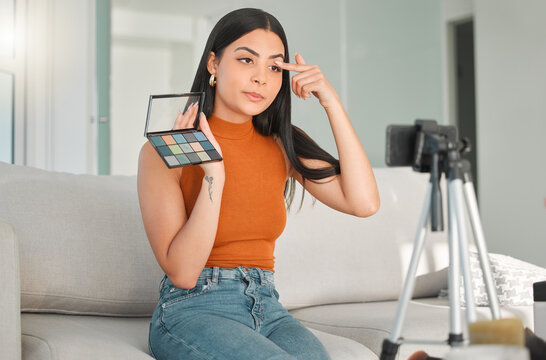 Influencer, makeup palette and woman with phone in home for social media, content creation and filming. Live streaming, beauty cosmetics and recording video for teaching, eyeshadow tutorial or tips