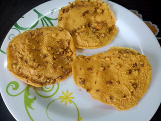 Crispy Peanut Snack or Rempeyek or peyek is a deep-fried savoury Indonesian-Javanese cracker close up. photo taken in malaysia
