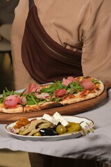 Italian Pizza with Arugula and Sliced Dried Turkey