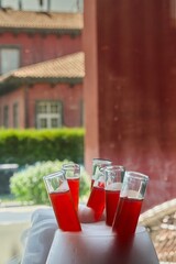 Red Cocktail in Test Tubes with Dry Ice Smoke