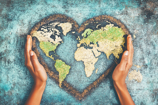 Earth's day celebration, hands shaped heart with world map