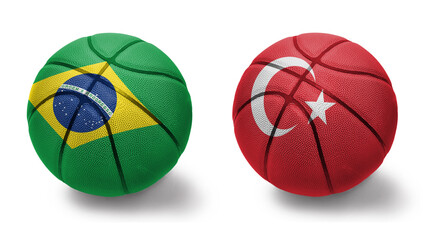 basketball balls with the national flags of turkey and brazil on the white background.