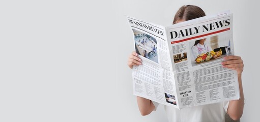 Woman reading morning newspaper on white background with space for text