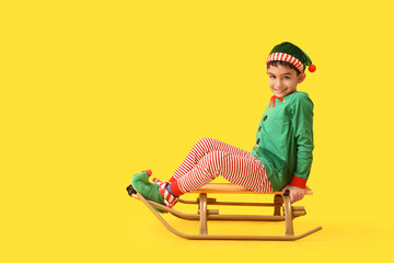 Cute little elf on yellow background