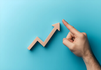 Hand Pointing Upward to a Rising Line Graph