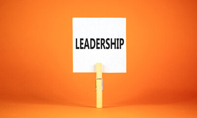 Leadership symbol. Concept word Leadership on beautiful white paper on clothespin. Beautiful orange...