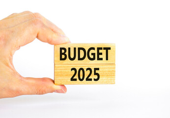 Planning budget 2025 new year symbol. Concept words Budget 2025 on beautiful wooden blocks. Beautiful white background. Businessman hand. Business budget 2025 new year concept. Copy space.