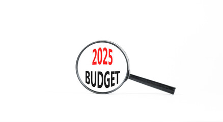 Planning 2025 budget new year symbol. Concept words 2025 Budget on beautiful white paper in magnifying glass. Beautiful white paper background. Business 2025 budget new year concept. Copy space.