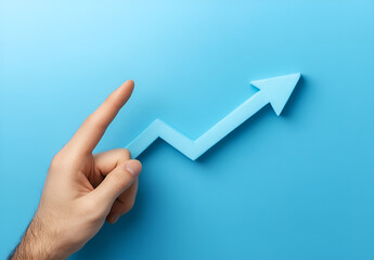 Hand Pointing Upward to a Rising Line Graph