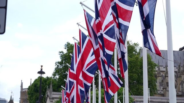 Many English flags flutter on the flagpole
