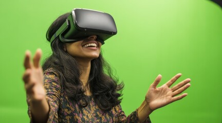 A woman happily explores virtual reality with a VR headset on green background.