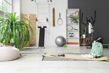 Interior of gym with modern sports equipment