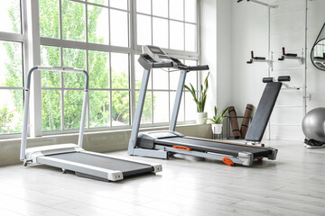 Interior of gym with modern sports equipment