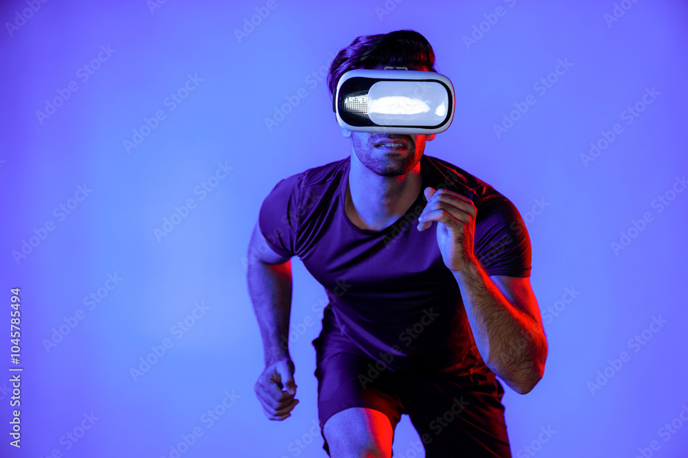 Poster caucasian smart man jogging while wearing vr goggle with neon light. happy person with casual cloth 