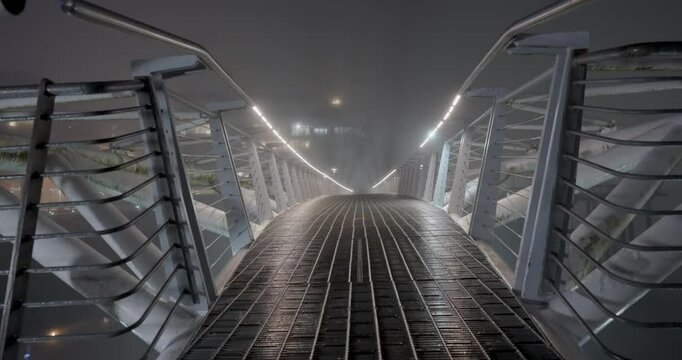 bridge over the river during a foggy winter night