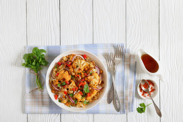 cauliflower chickpea quinoa salad in a white bowl