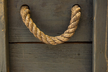 string hanging on a wooden wall