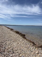 beach with stones and clouds