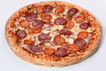 Pizza Margarita with sausage isolated on a white background. Side view