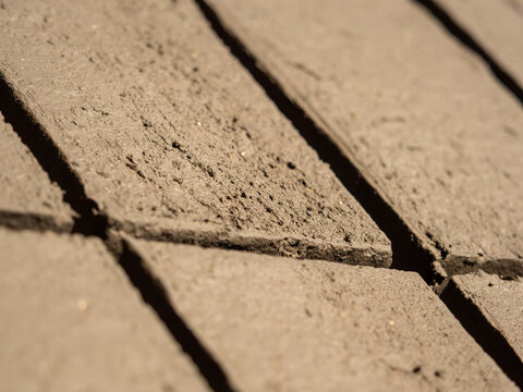 Production of mud bricks for construction purposes