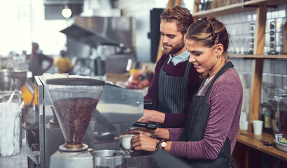 Cafe, man and woman at coffee machine together for morning service with small business employees. Espresso, drink and barista in restaurant with server, teamwork and support at hospitality startup.