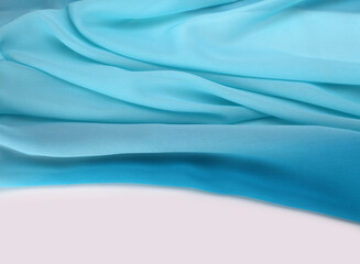 Blue wave silk fabric. Abstract texture copy space background.