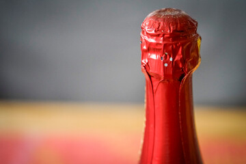 Detail of a closed neck of sparkling wine bottle