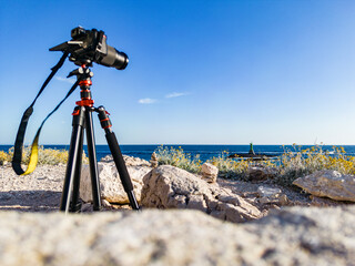 Camera on tripod, turned to the Punta Planka lighthouse ready for taking photos of this most distant part of croatian coast splashed by the open sea
