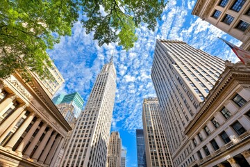 Fototapeta premium Buildings or skyscrapers in a financial district with clouds on a sunny day in Chicago, USA. Concept of business enterprise, construction, or communication.