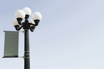 beautiful black lamp post with room for copy announcement or advertising backdrop
