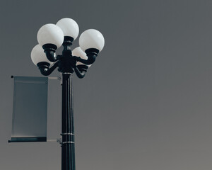 street lamp in the sky on a post with a banner with room for copy for announcement or advertising...