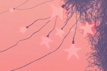 Decorative star lights hanging against a soft pink sky during twilight at an outdoor gathering