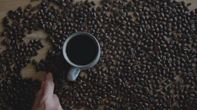 Woman hand writing on coffee beans number 2025