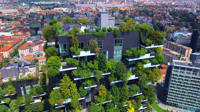 Aerial view of modern and environmentally friendly skyscrapers with many trees on the balconies. Bosco Verticale. Architecture, vertical gardens, terraces. Green Planet. Milan, Italy, 19.08.2024