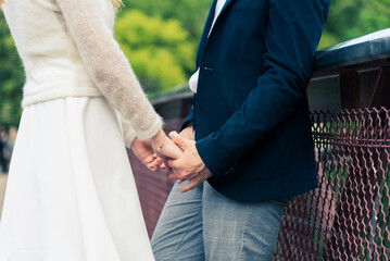 Fototapeta premium bride and groom holding hands