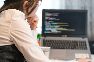 Woman Working And Programming On Computer In Office.woman working on coding on laptop