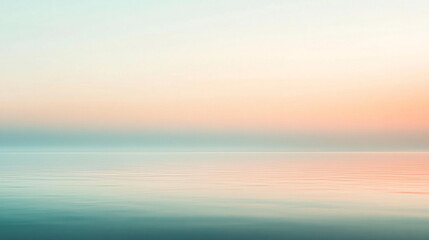 Fototapeta premium Calm Ocean Water with Soft Sunset Sky Background