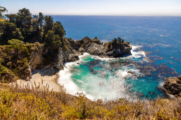 Discover McWay Falls, a stunning coastal waterfall in Big Sur, California, cascading directly into...